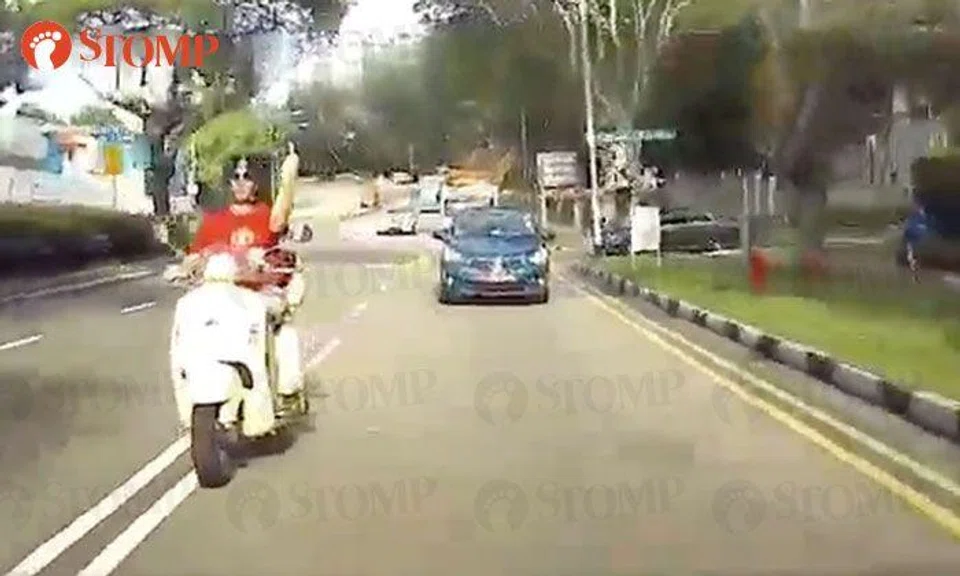 Motorcyclist sounds horn, flashes the finger after being overtaken -- then crosses double white lines