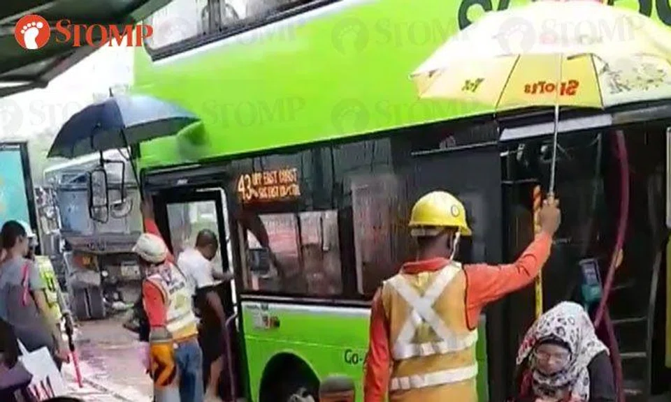 Foreign workers sacrifice break time to shield bus commuters from the ...