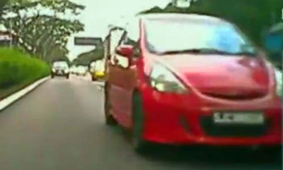 Watch how biker and driver repeatedly overtake each other on expressway