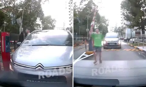 Driver foiled trying to evade parking fee by tailgating, angrily gets out to chase car before giving up