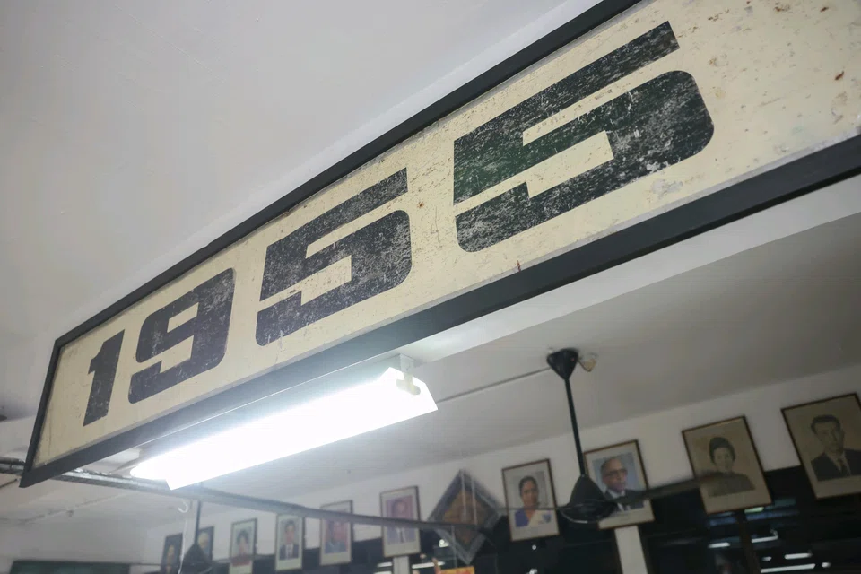 A close-up of the '1955' sign, referencing the year that the Labour Front won the election, seen at Treasure At Home Vintage Store.