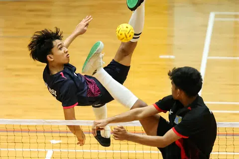 Marsiling Secondary School's Muhammad Herzy Khaliff (left) leading his team to victory in the 2025 National School Games B Division sepak takraw final on March 10.
