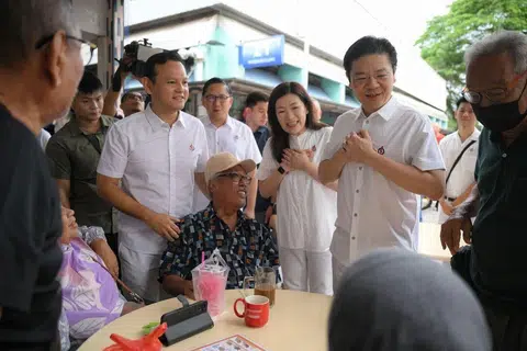 (From right) PM Lawrence Wong and his Marsiling-Yew Tee GRC teammates Hany Soh, Alex Yam and Zaqy Mohamad greeting residents at Marsiling Market on May 4.
