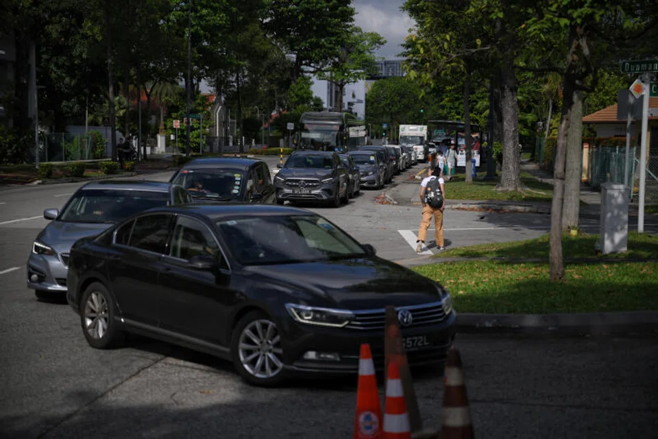 Cars queuing for cheaper petrol at Katong Cnergy station block buses from bus stop