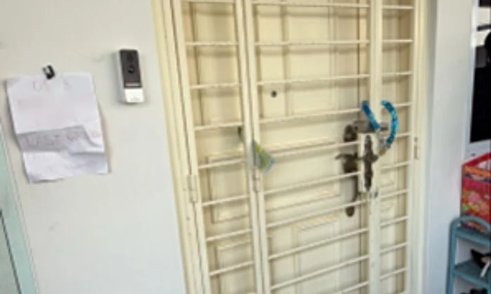 It took 2 people to chain gate and leave debtor's note at Jurong West flat, man and woman arrested