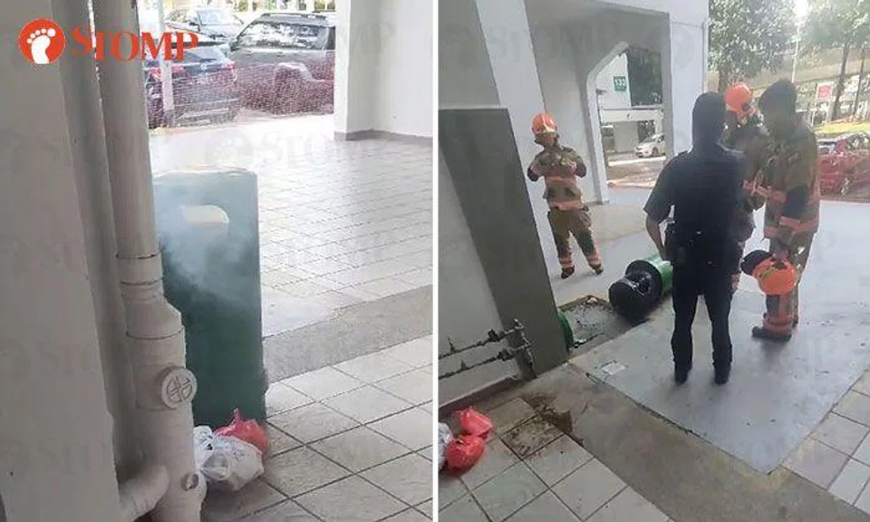 Member of public uses buckets of water to put out bin fire at Geylang East