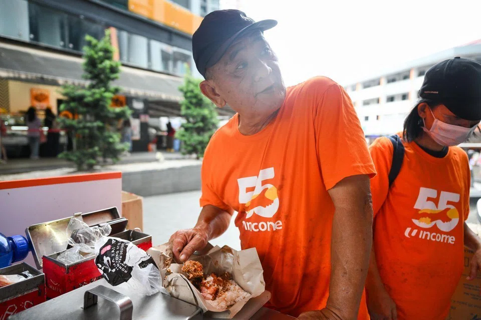Mr Cheong taking a short break have his lunch duck rice and roasted meat, which he took roughly five minutes to eat. ST PHOTO: SHINTARO TAY