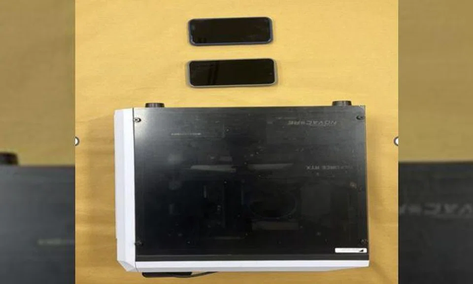 Police raid home of man who took woman's upskirt photos on escalator at Downtown MRT station