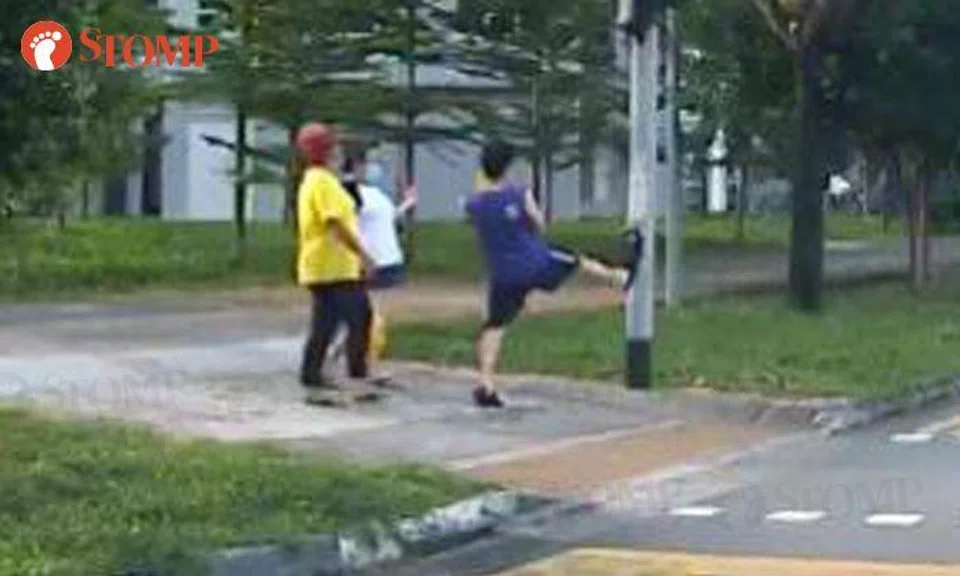 Inconsiderate pedestrian presses traffic light button... with his leg