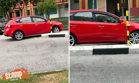 Car goes over road divider at Woodlands Drive 50