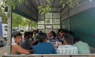 Workers from KPA Engineering in a lorry near the MOM Services Centre in Bendemeer on June 23.