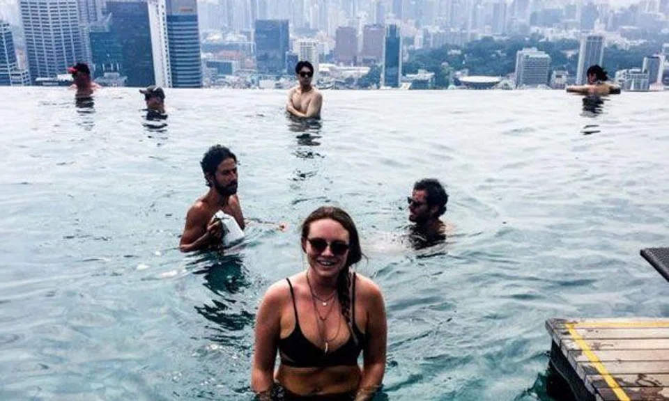 Backpackers boast about sneaking into MBS infinity pool online -- even though it's illegal