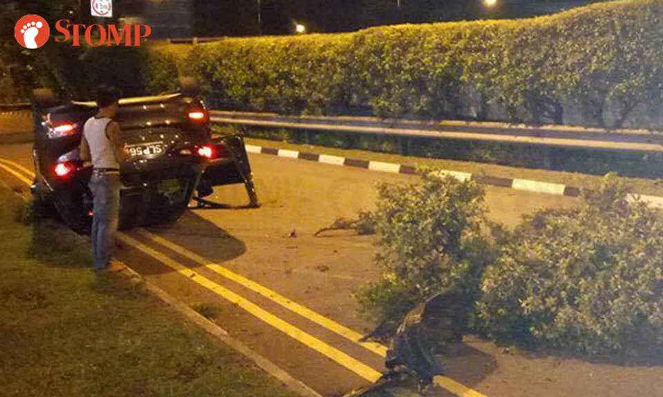Driver 'crawls out' of Mazda that crashed through road divider, 'flew ...