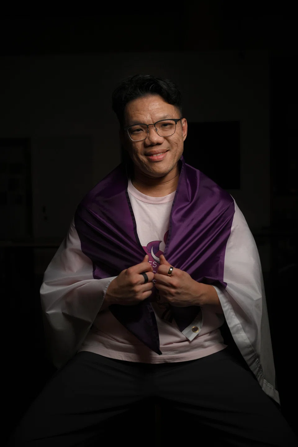Mr Teng Yong Ping, holding the asexual flag, started monthly meetups because he was looking for others who shared the same complicated feelings as him.