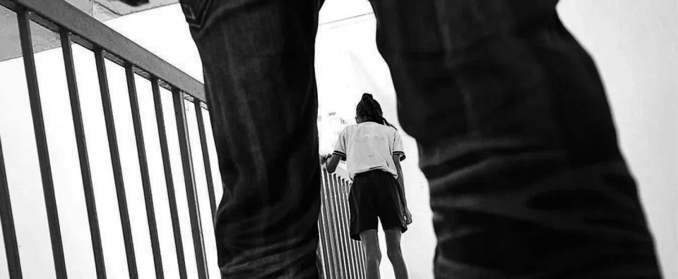 The man, who was described as wearing a red T-shirt, allegedly approached the woman from behind and held her by the waist.