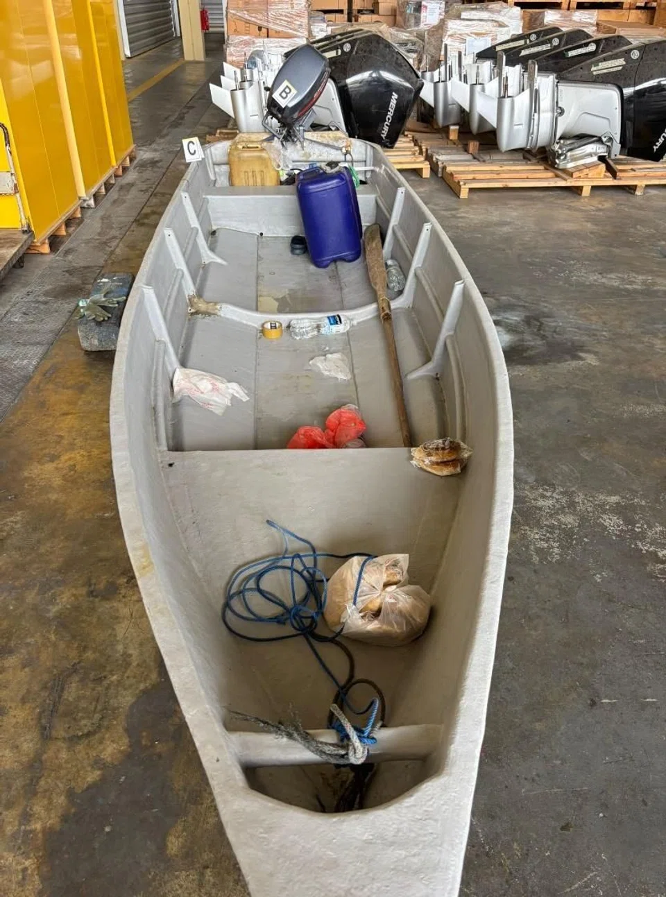A total of 2,700 packets of assorted duty-unpaid cigarettes and one fibreglass craft (pictured) were seized in the operation.