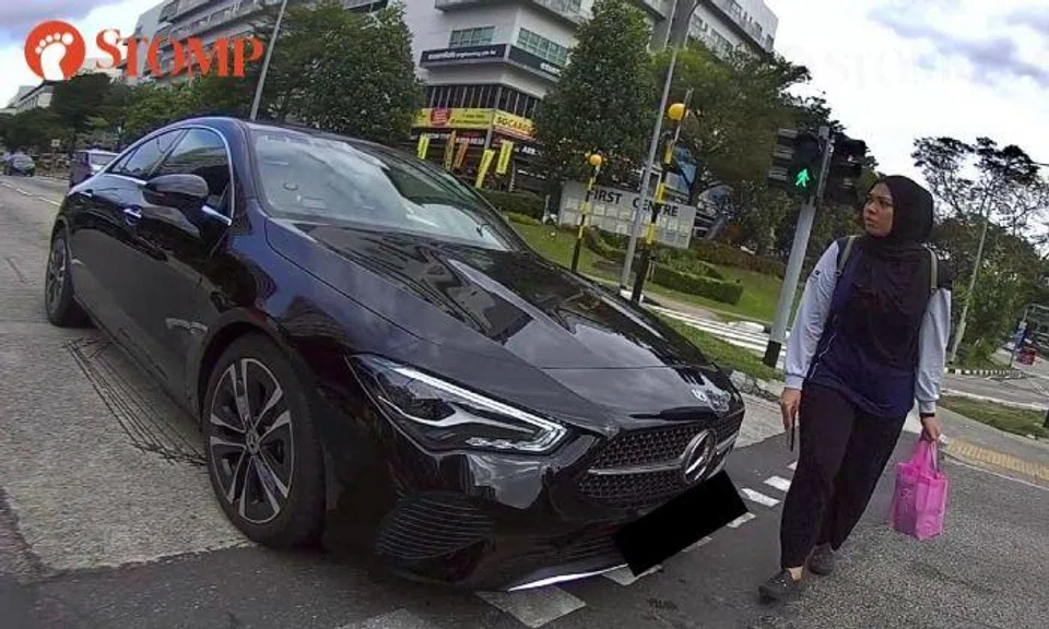 Mercedes-Benz narrowly misses hitting pedestrian at Serangoon North