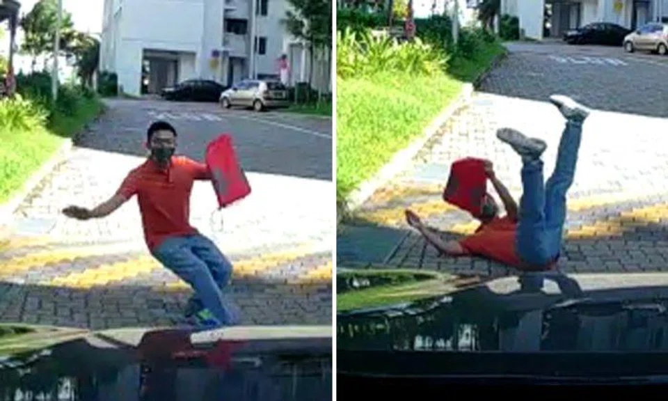 Pedestrian tumbles to the ground not once but twice -- even though car hasn't touched him