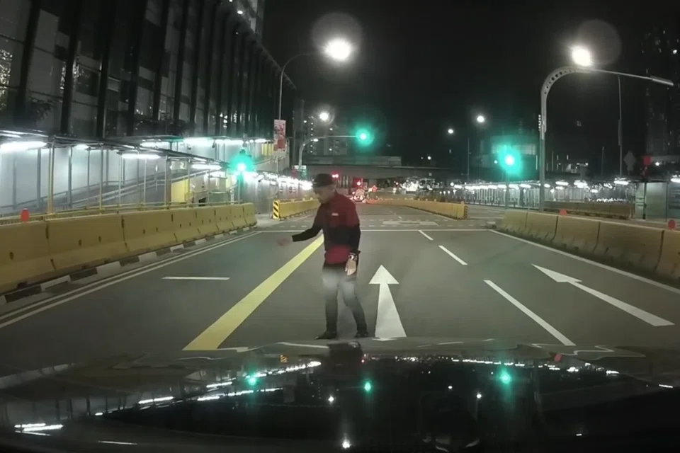 The man who stopped in the middle of the road appeared to be inebriated. 