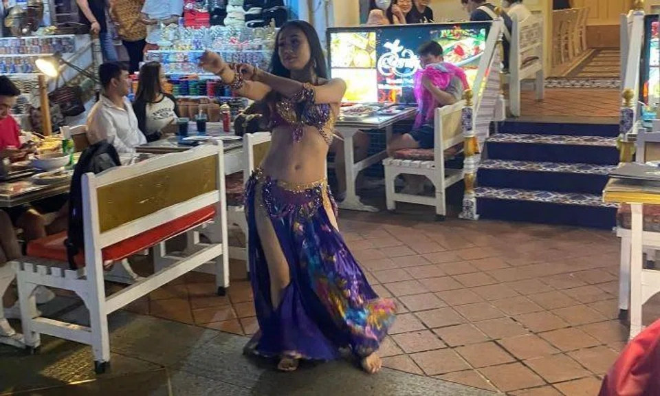 "Our patron who had performed had, in fact, worn a fitted skin-coloured vest that was draped on the outside in a belly-dancer costume."