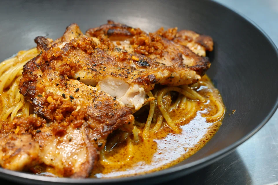 Chicken Chop With Laksa Spaghetti. ST PHOTO: NG SOR LUAN
