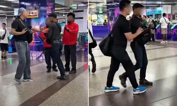 man enters city hall mrt station to confront passenger, taps out 30 seconds later after staredown 