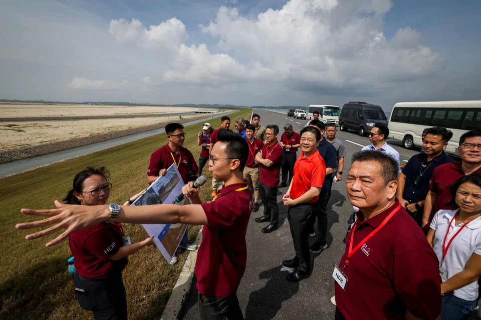 PM Lawrence Wong at a site briefing during his visit to the completed polder at Pulau Tekong on Sept 8.