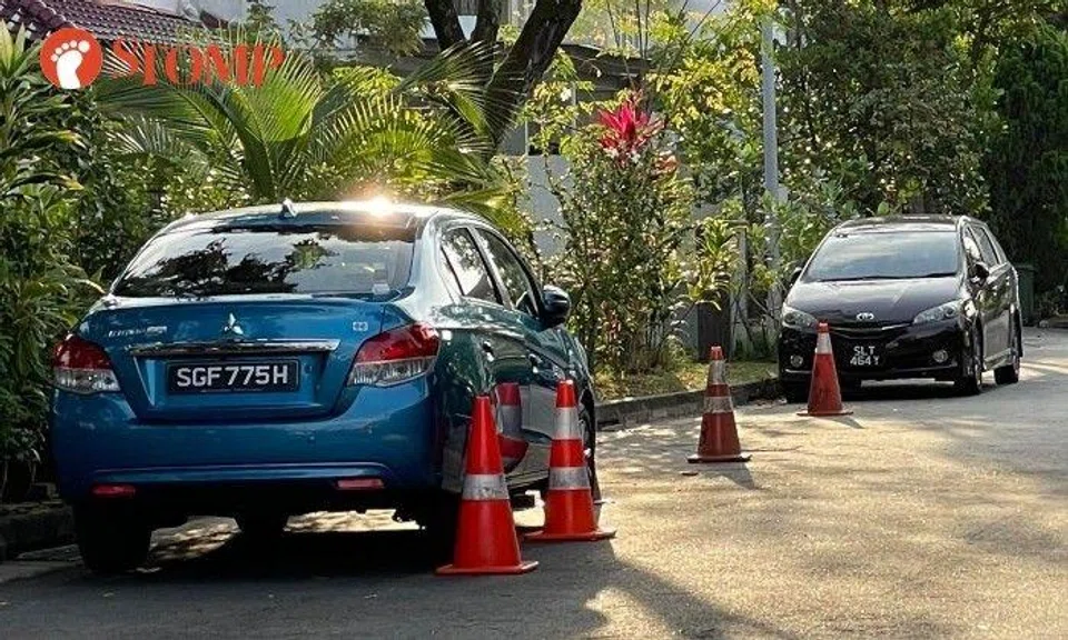 Stomper: "Some residents in the Hoover Park estate are even bolder. They buy their own traffic cones to demarcate the area outside their house for their own parking usage."