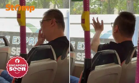 Man digs nose and wipes finger on bus