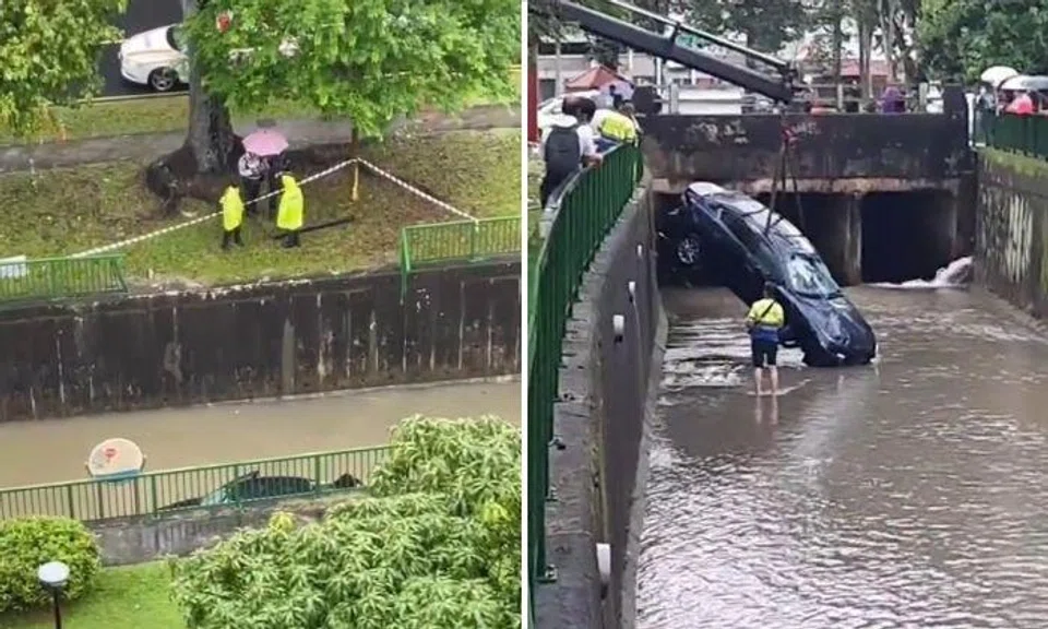Car partially submerged in rainwater after skidding into canal, 62-year-old woman taken to hospital