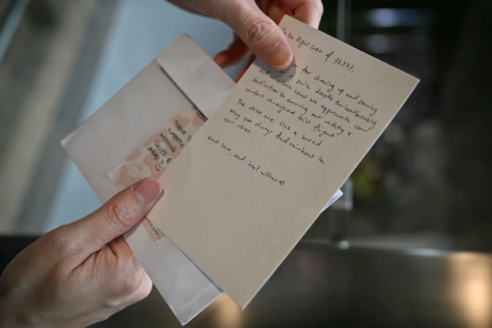 Mr Wayne Lee, 42, an in-flight customer service manager with Jetstar Asia, shows the note a passenger left for him.