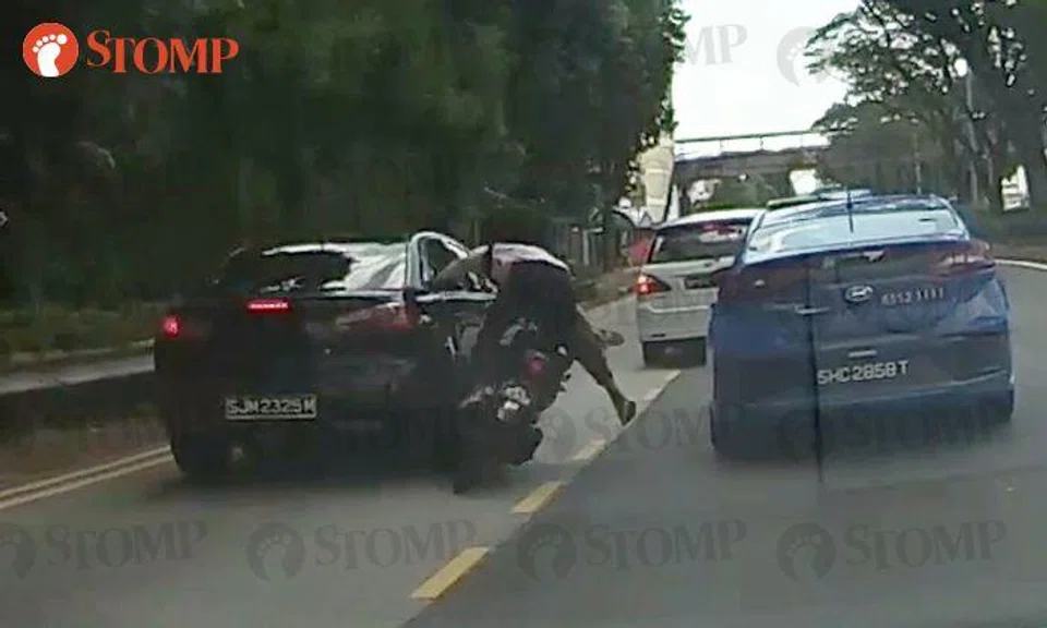 Ouch! Motorcyclist crashes into car and hits taxi at Simei Avenue