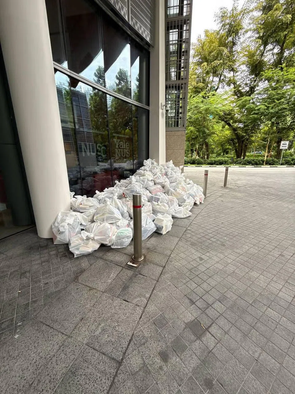 Books were stacked in plastic bags at the drop-off point of Yale-NUS College, next to NUS University Town in Kent Ridge. PHOTO: THE STRAITS TIMES