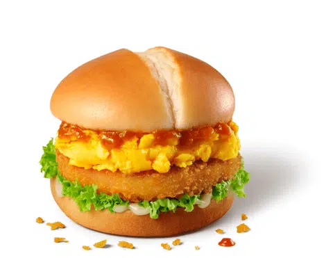 The Chilli Crab Sauce Prawn Burger features a prawn patty topped with a fluffy scrambled egg and lathered with chilli crab sauce. 