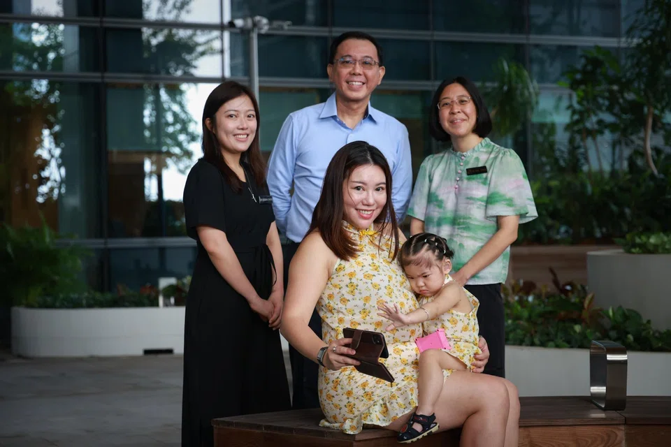 Madam Low Yoke Mui (seated) and her daughter Yanna Liu with Yanna’s doctors (from left) Debbra Chong, David Low and Gail Chua.