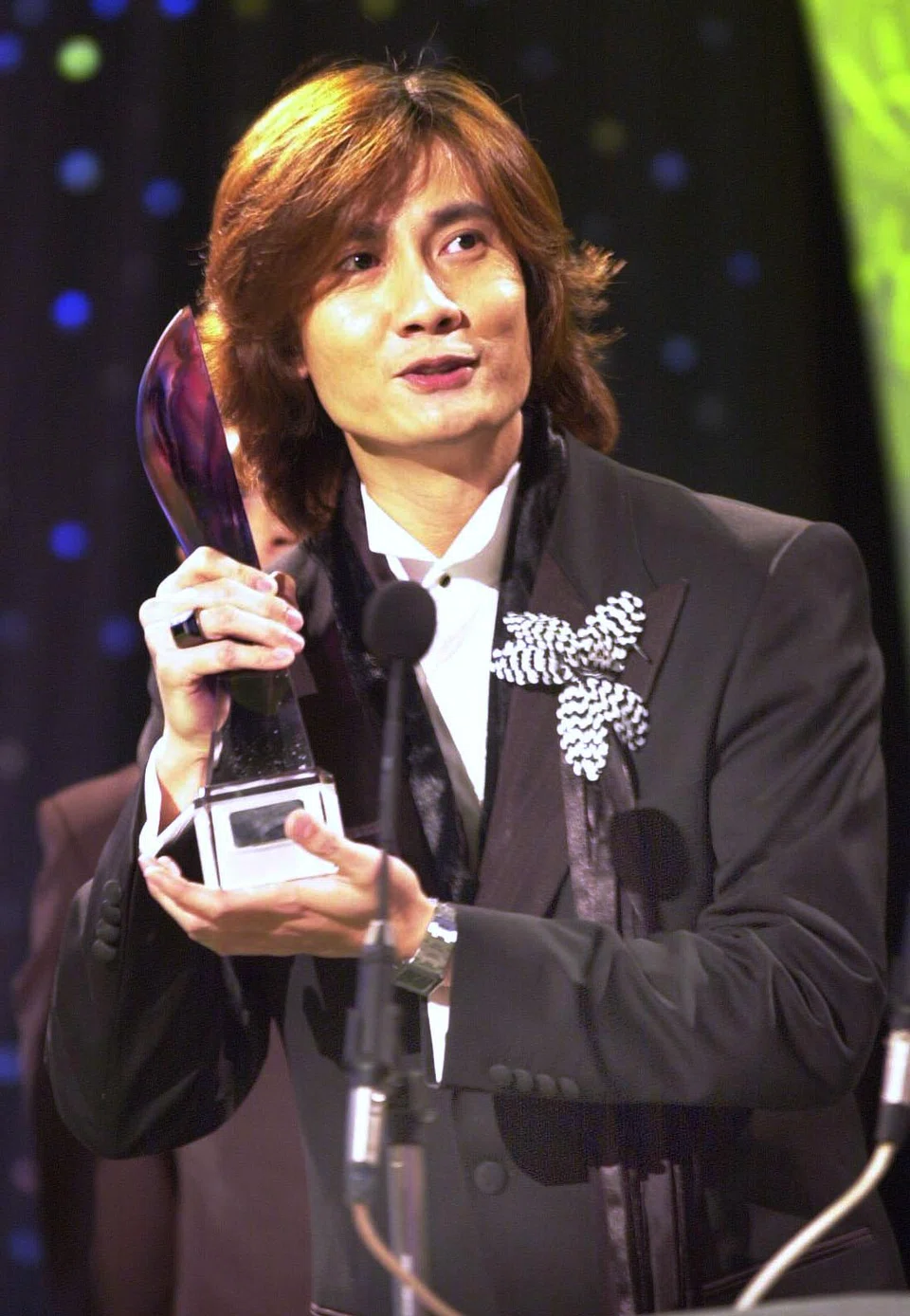 Chen winning Best Actor in 2001 for the drama Love Me, Love Me Not.