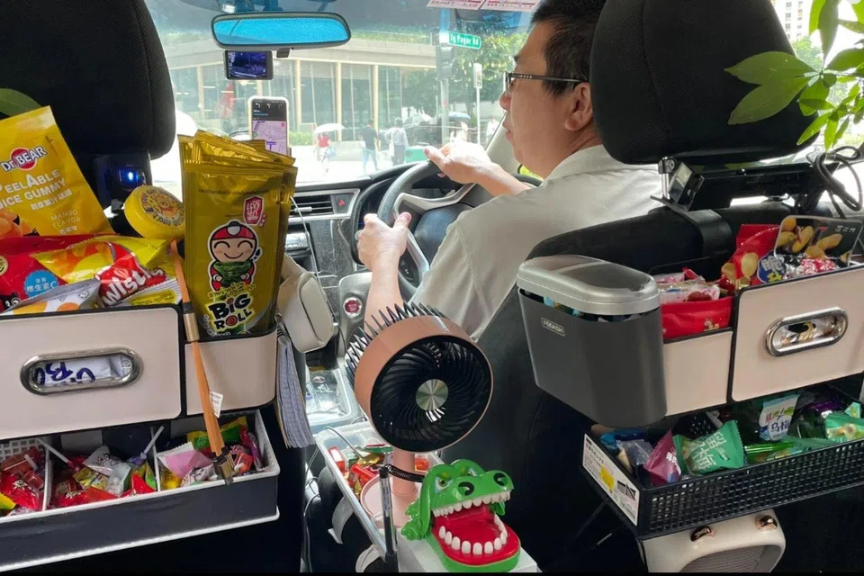 Mr Pang Tze Wei's Grab car comes with snacks, bottled water, charging cables and even potted plants. 