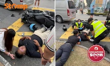 Motorcyclist lies on road after accident with van in Yishun