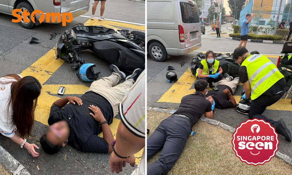 Motorcyclist lies on road after accident with van in Yishun