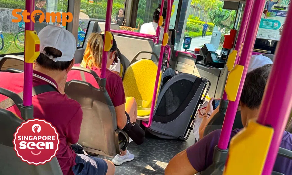 Bus aisle obstruction by pet wagon