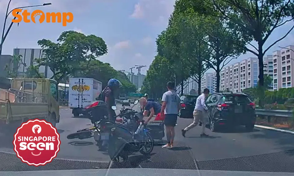Motorcyclist crashes into rear of car on PIE, taken to hospital and assisting with investigations