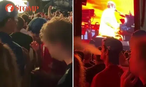 Audience member smokes during Elton John's F1 concert at Padang