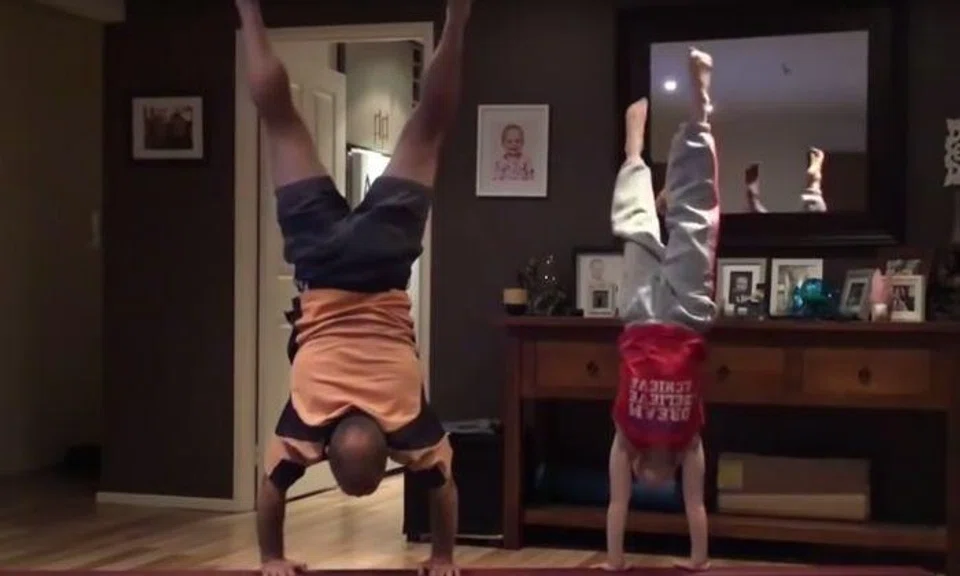 Dad boosts daughter's self esteem by trying her gymnastic moves 