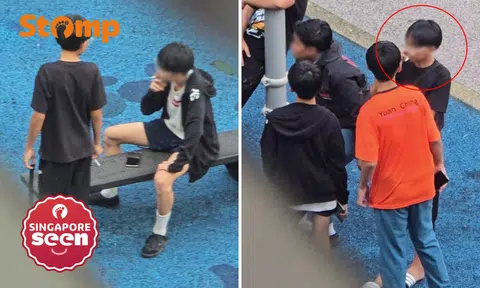 Youths smoke at Jurong West exercise area, one throws cigarette butt on ground