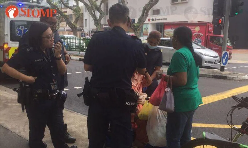 Police stop to help elderly woman who fell out of wheelchair after colliding with bicycle