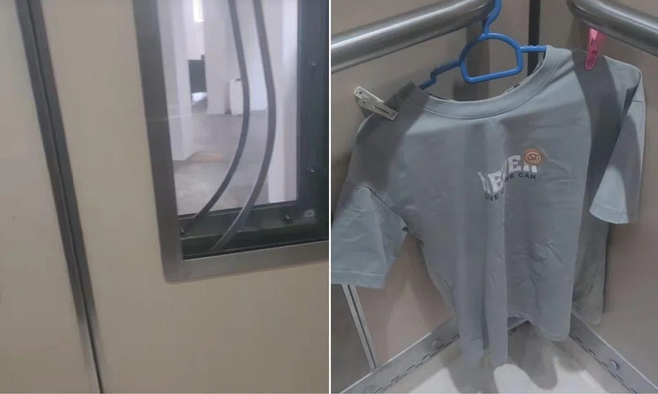 The woman filmed a greyish-blue shirt hanging in the corner of the lift.
