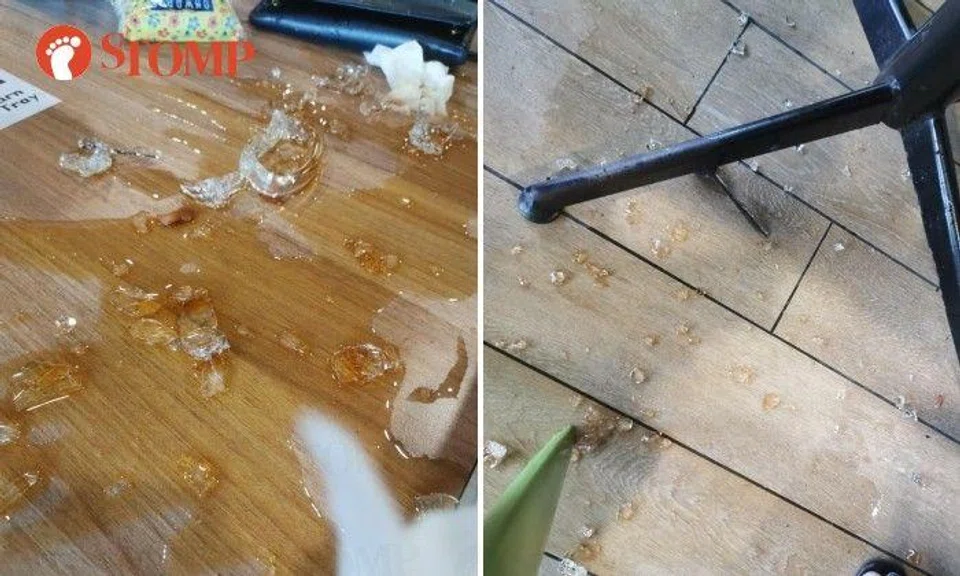 The Stomper shared photos of the glass pieces and the spilt drink on the table and floor.