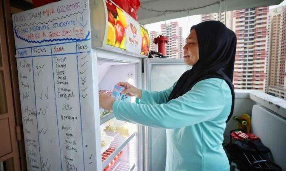 Marlina Yased started a community fridge initiative offering free food, such as vegetables, frozen meat and seafood, to her neighbours in need. Photo: The Straits Times