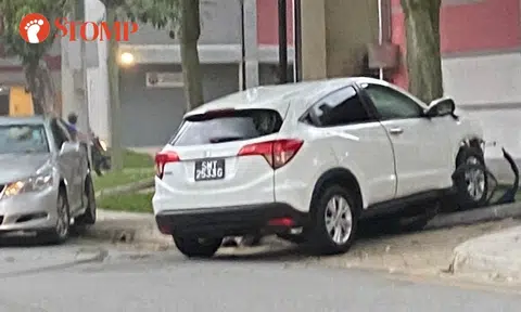 Woman taken to hospital after car hits another car and crashes into tree in AMK carpark