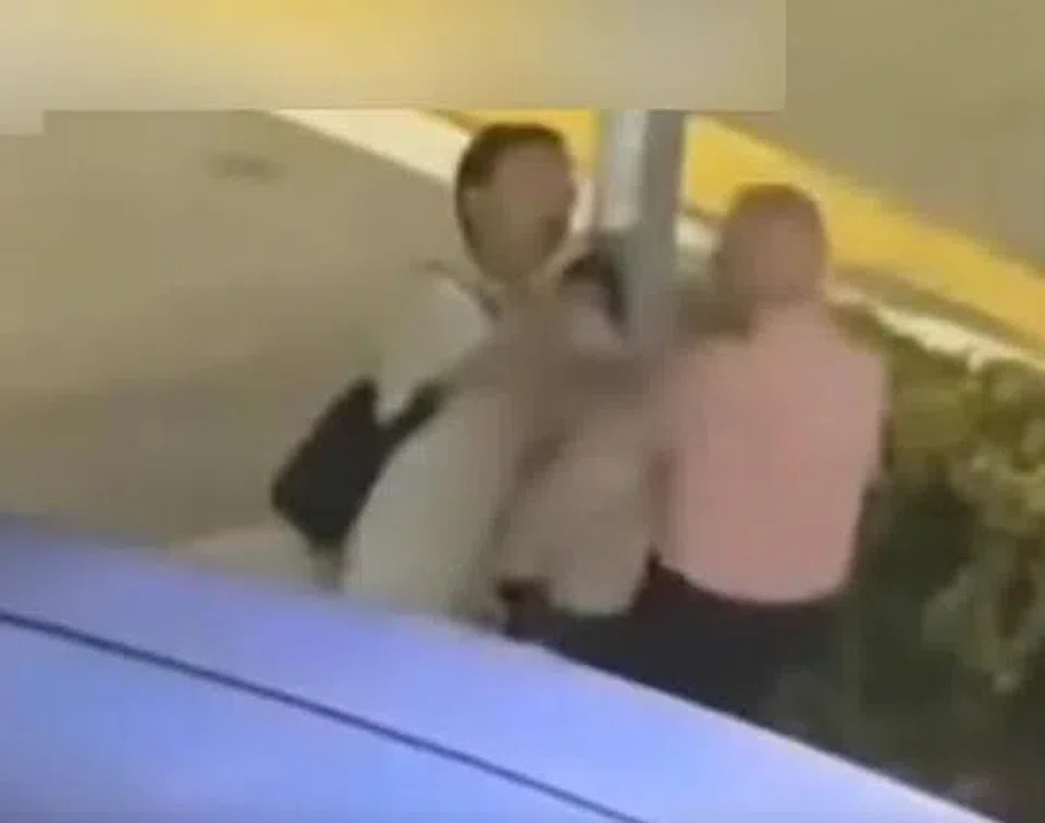 The old man was pushed in the chest after pulling a plastic bag from another man.